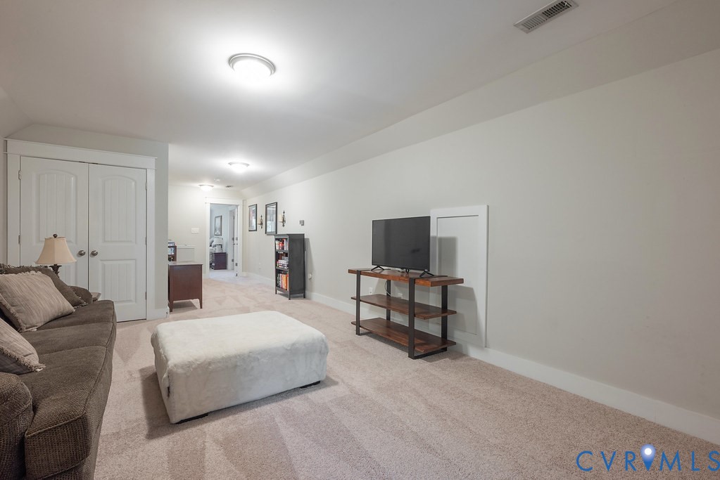 6446 Chestnut Church Road Mechanicsville, VA 23116 - Photo 30 of 49 Second floor carpeted recreation room with light g