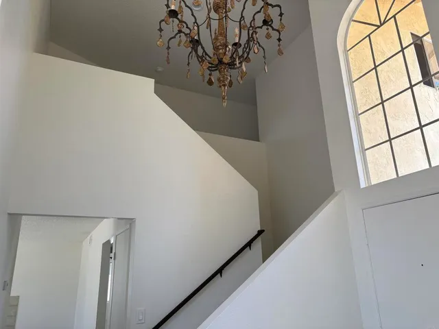 a view of a hallway with windows