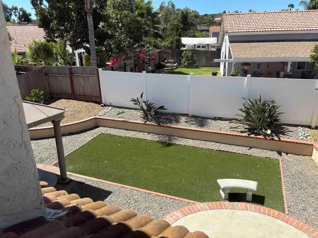 a view of a swimming pool with a patio