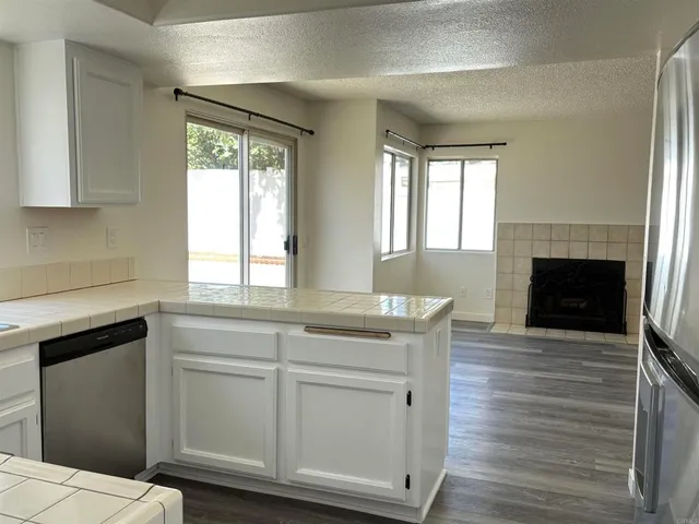 a kitchen with a sink and a fireplace