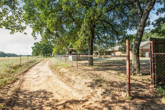 a view of backyard space and deck
