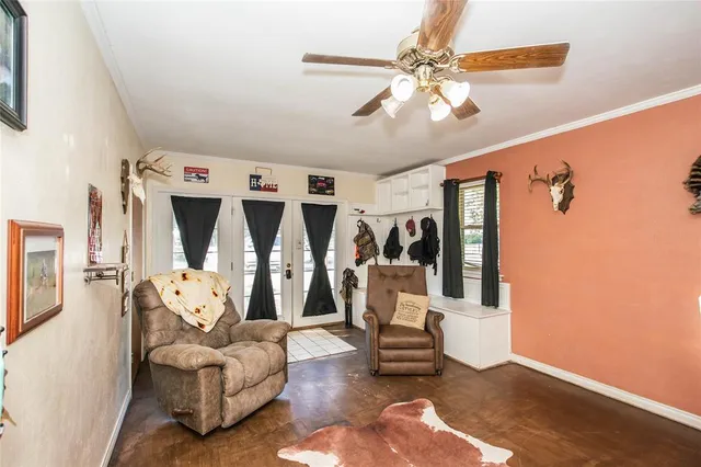 a living room with furniture and white walls