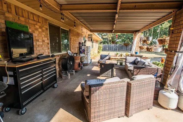 a outdoor space with patio furniture and a fireplace