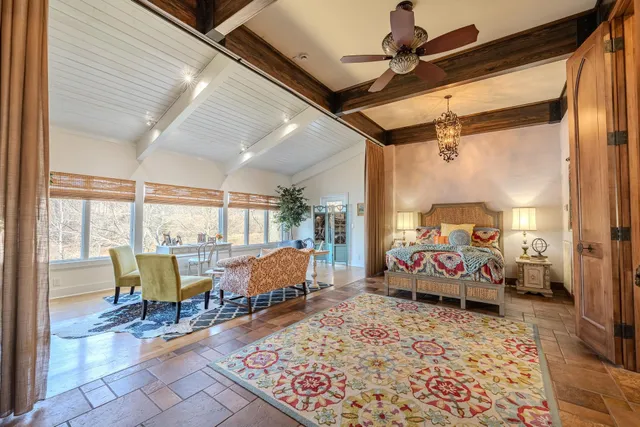 a bedroom with furniture and a window