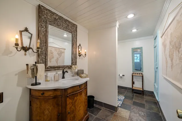 a bathroom with a sink and a mirror
