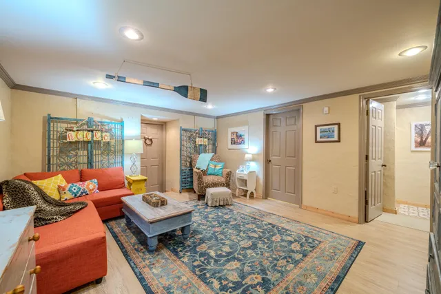 a living room with furniture and a rug