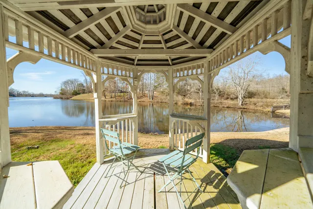 a view of a chairs and table on the deck