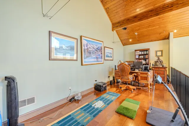 a room with musical instruments on wooden floor