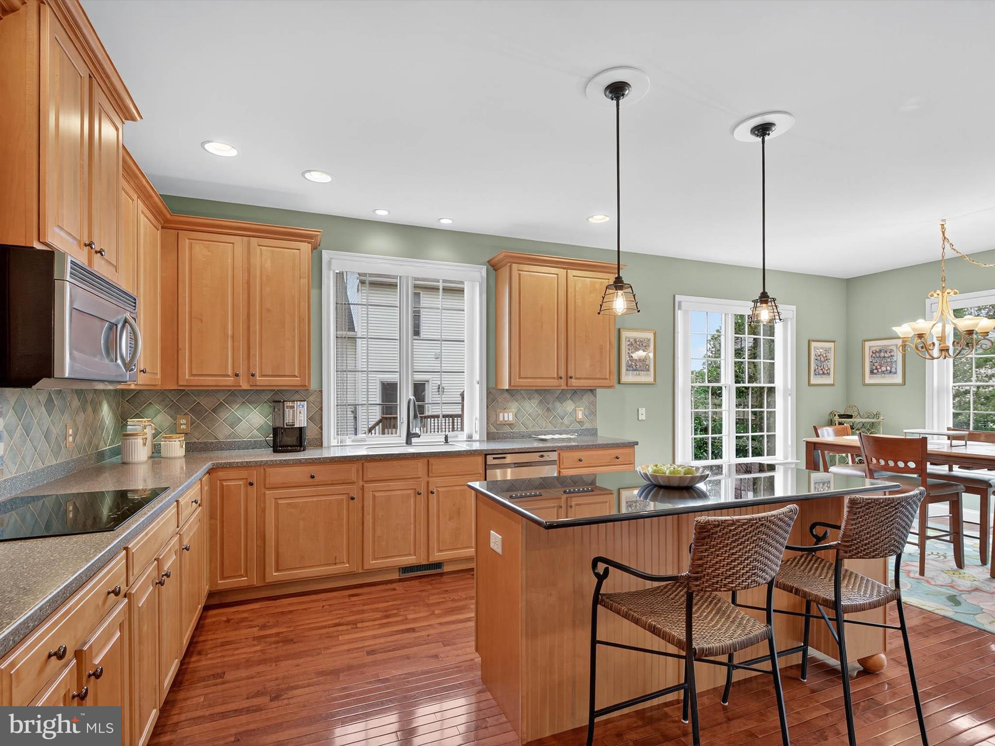 213 Barkay Crossing Lititz, PA 17543 - Photo 30 of 112 a kitchen with stainless steel appliances granite countertop sink stove and wooden cabinets