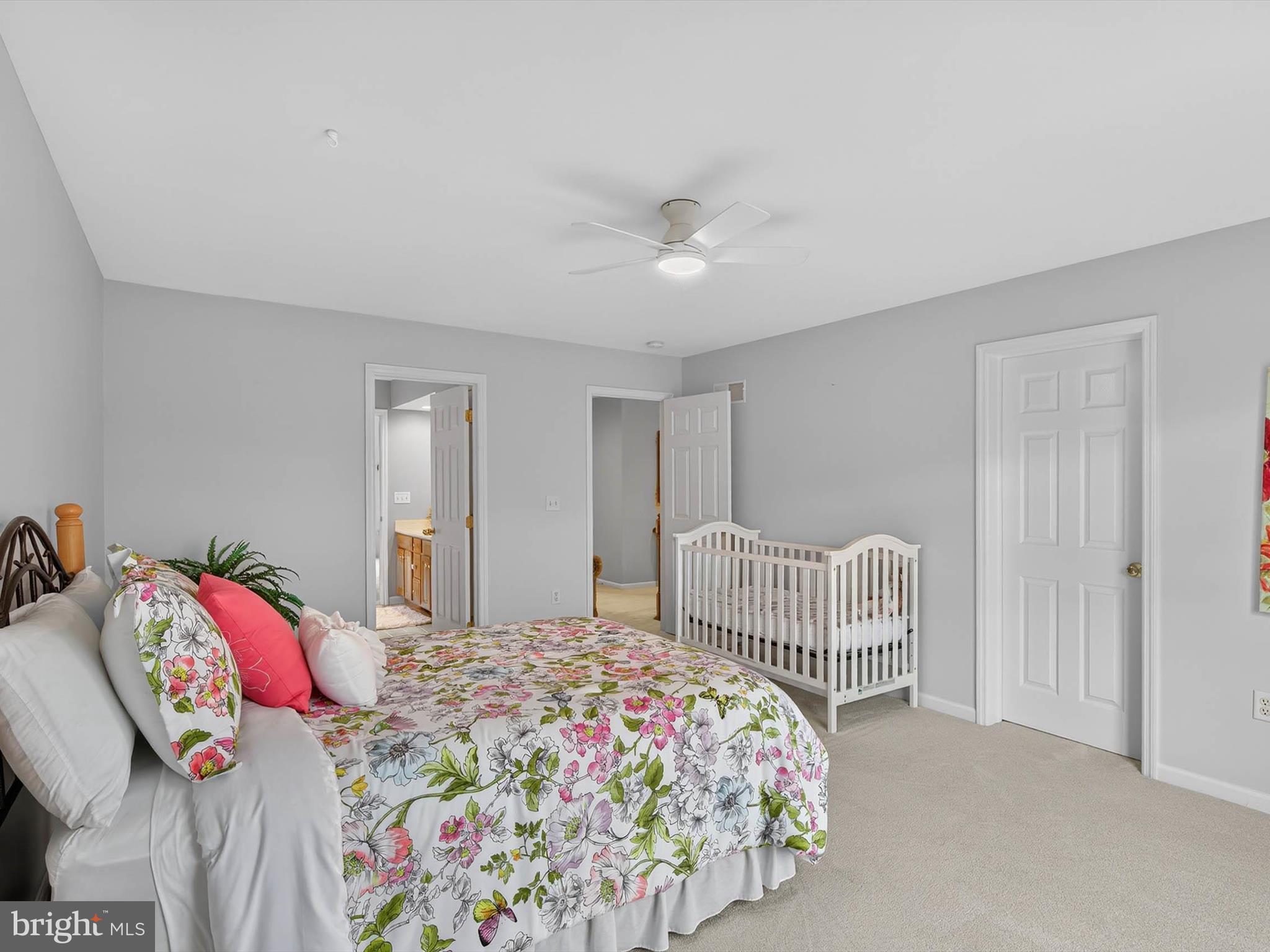 213 Barkay Crossing Lititz, PA 17543 - Photo 72 of 112 a bedroom with a bed and a chandelier