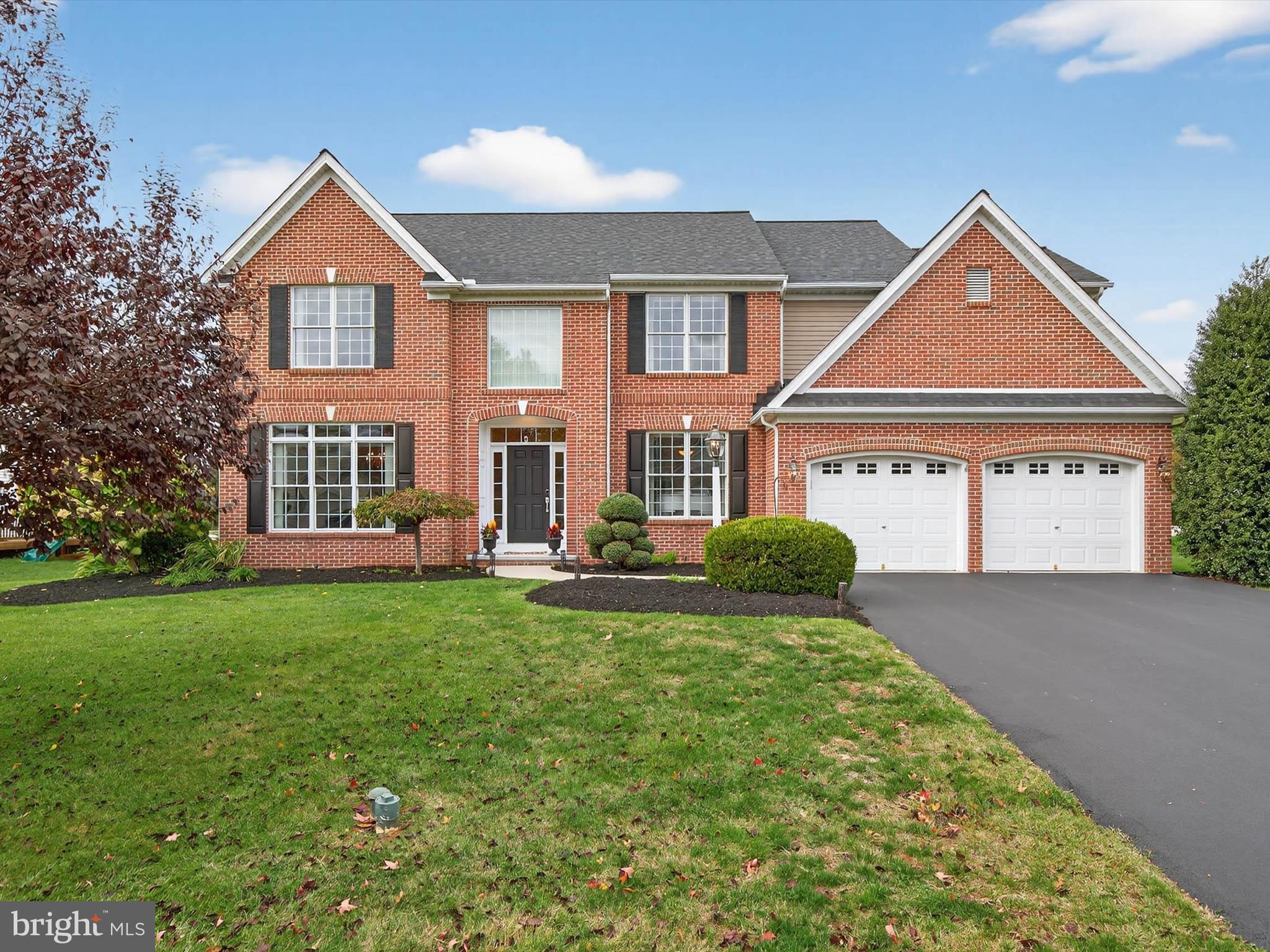 213 Barkay Crossing Lititz, PA 17543 - Photo 9 of 112 a front view of a house with a yard and garage
