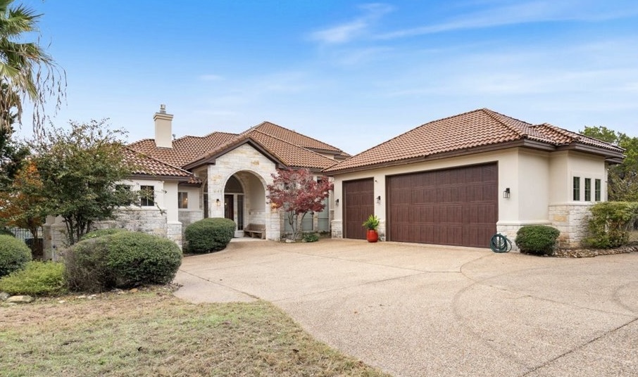 7304 Matisse Pointe Drive Leander, TX 78645 - Photo 1 of 25 a front view of a house with a yard and garage