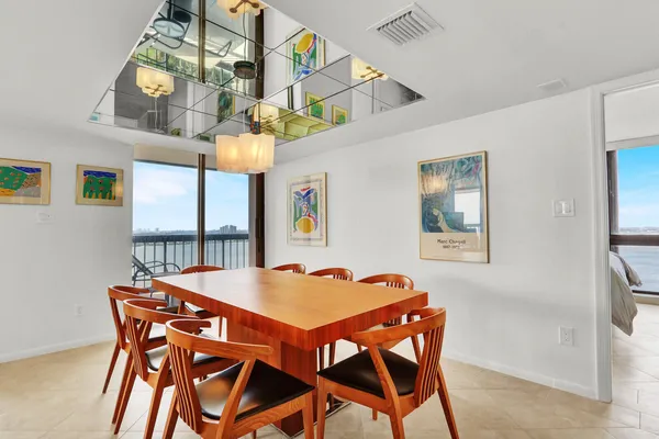 a view of a dining room with furniture and window