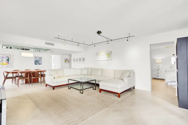 a living room with furniture and a table