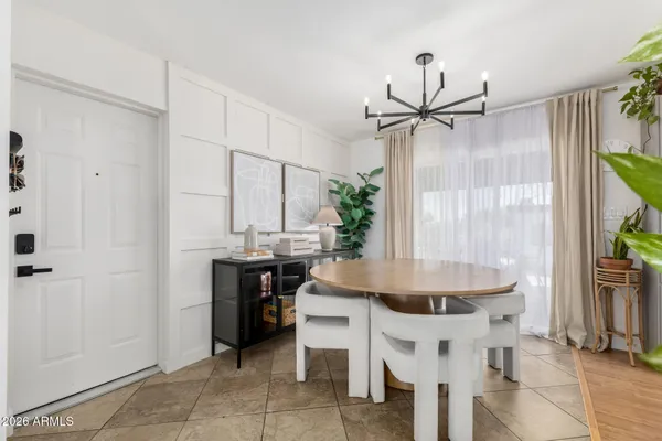 a kitchen with a table and chairs