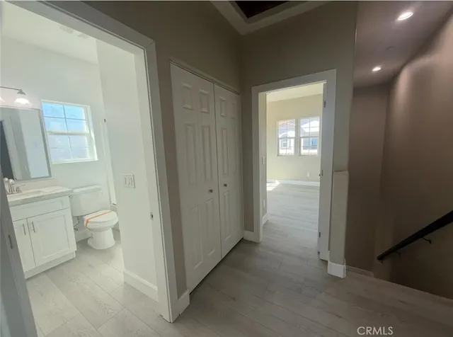 a bathroom with a granite countertop toilet and a shower