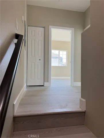 a view of an entryway with kitchen