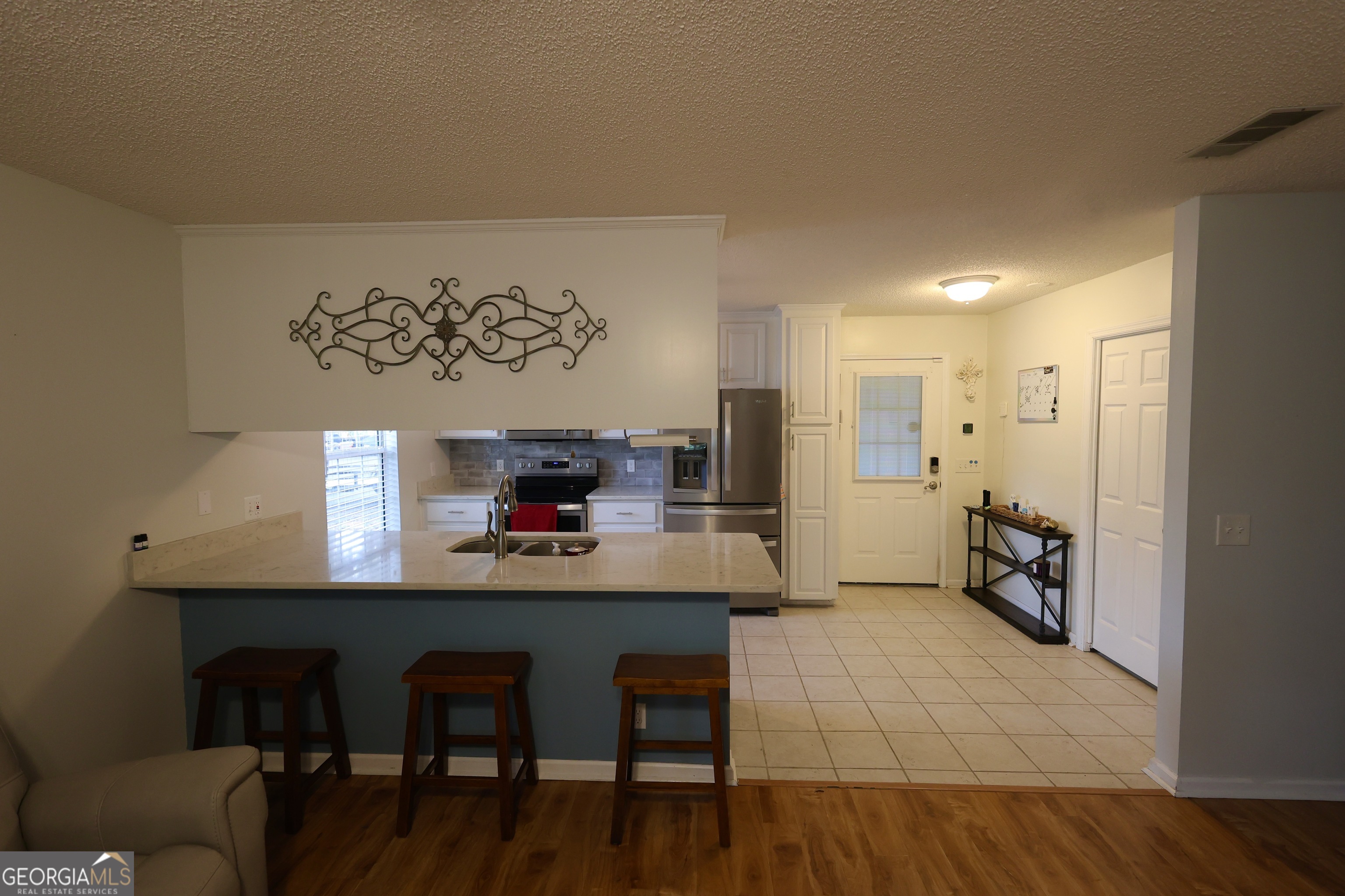 950 Old Jesup Road Brunswick, GA 31520 - Photo 13 of 20 a view of kitchen with furniture and wooden floor