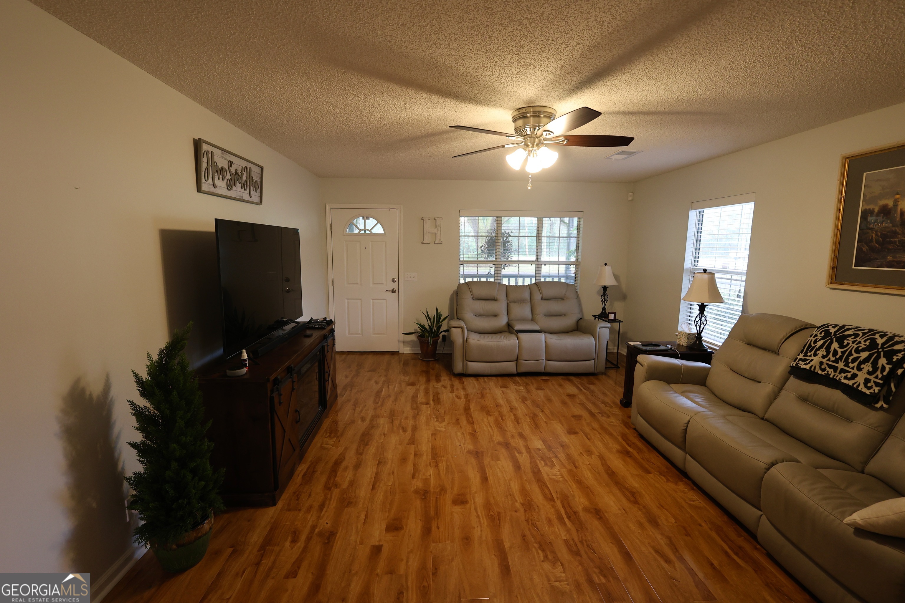 950 Old Jesup Road Brunswick, GA 31520 - Photo 15 of 20 a living room with furniture and a flat screen tv