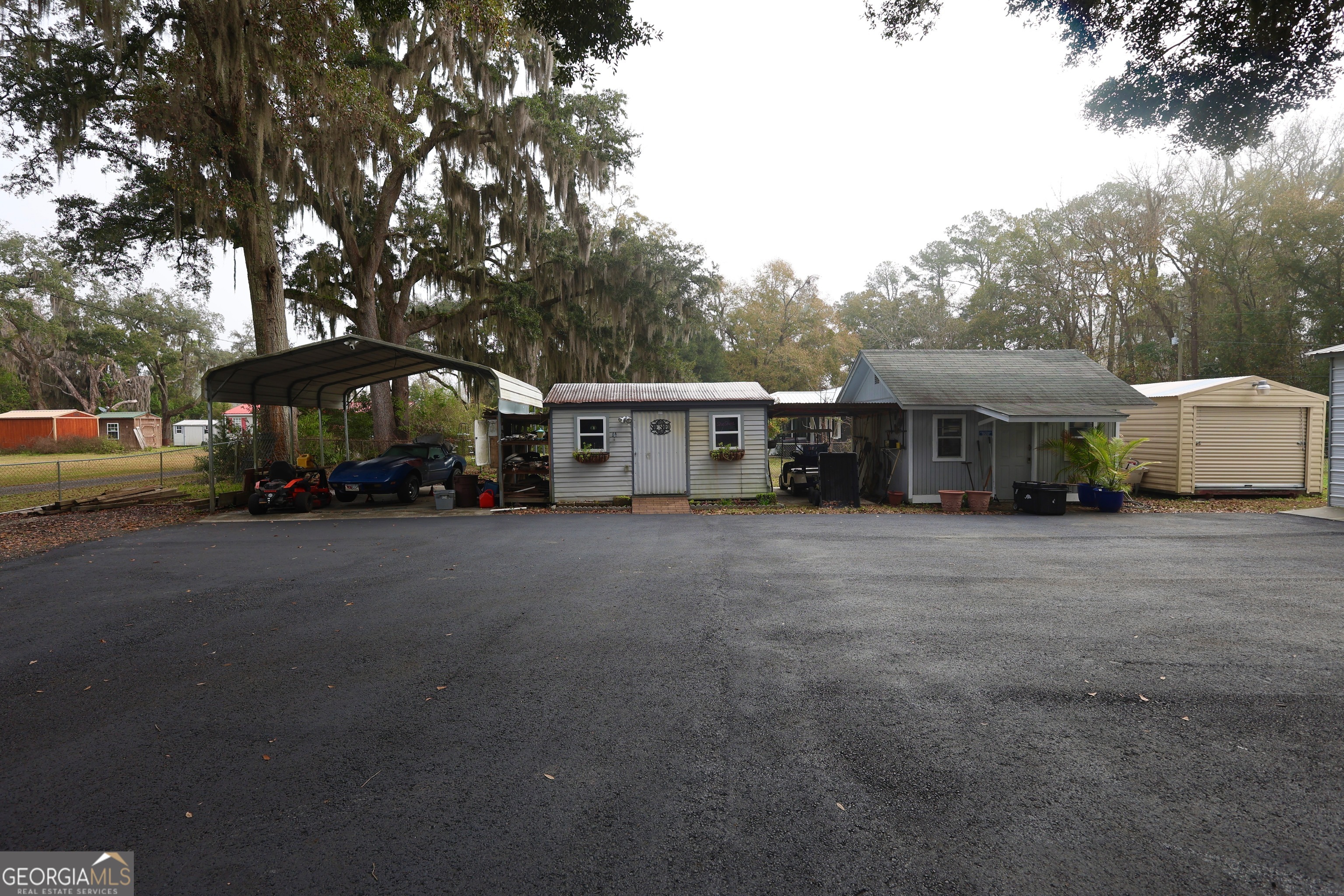 950 Old Jesup Road Brunswick, GA 31520 - Photo 6 of 20 a view of a house with a yard and sitting area