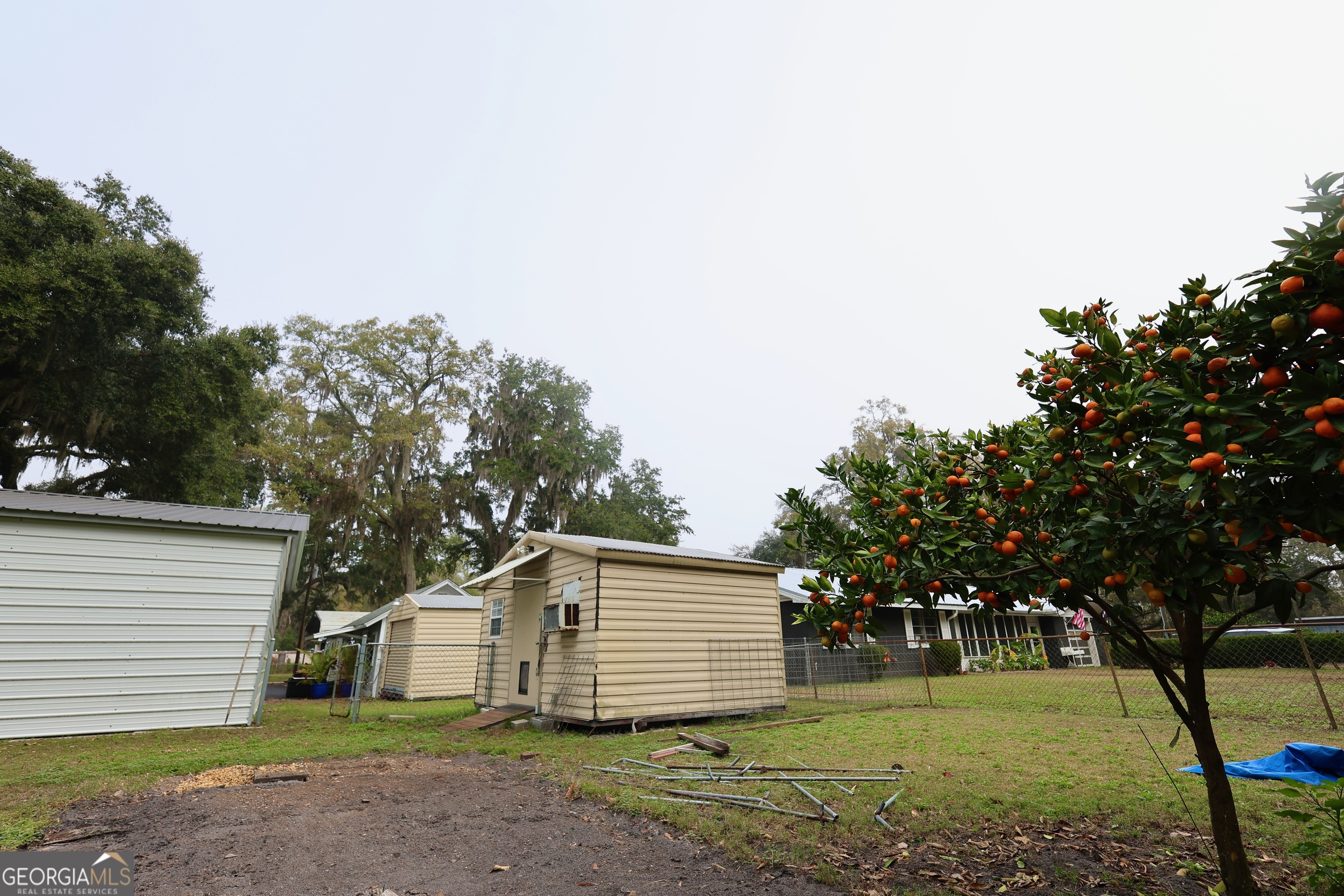 950 Old Jesup Road Brunswick, GA 31520 - Photo 9 of 20 a front view of a house with a garden