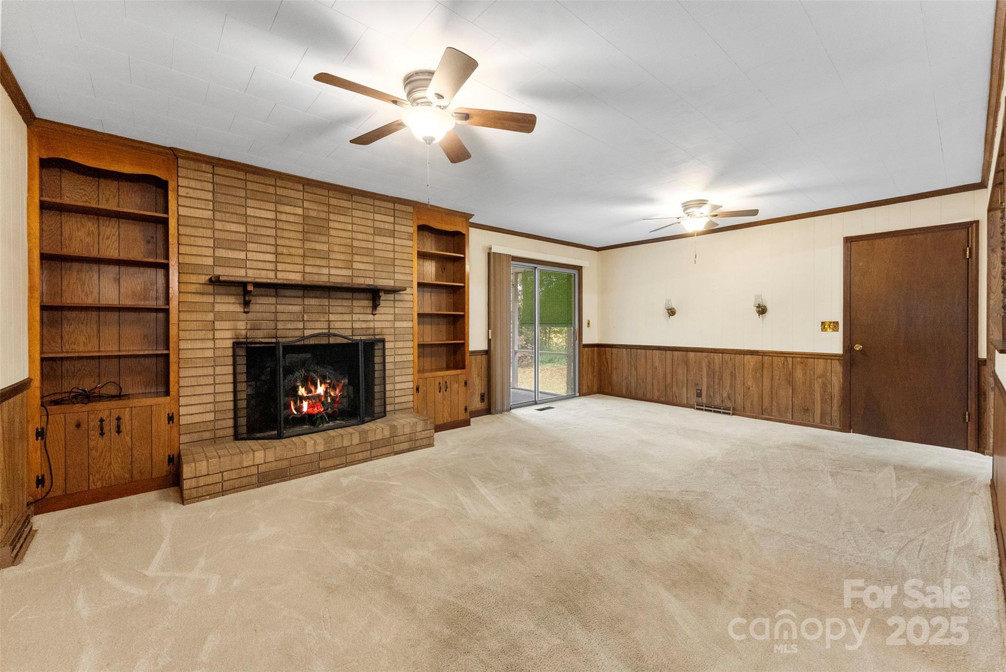 1819 Ratchford Road Dallas, NC 28034 - Photo 13 of 38 a view of an empty room with a fireplace and a window