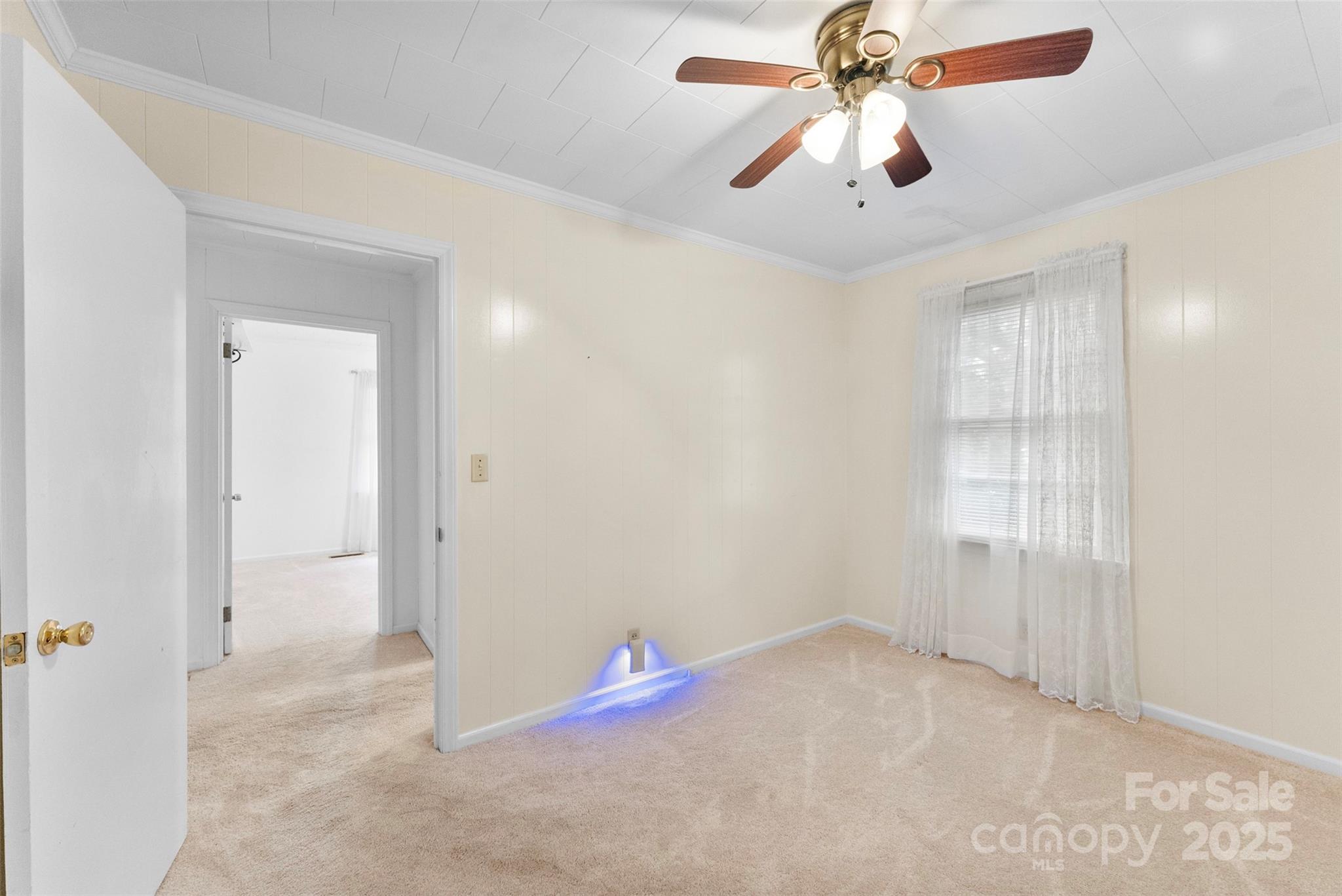 1819 Ratchford Road Dallas, NC 28034 - Photo 18 of 38 an empty room with closet and chandelier fan
