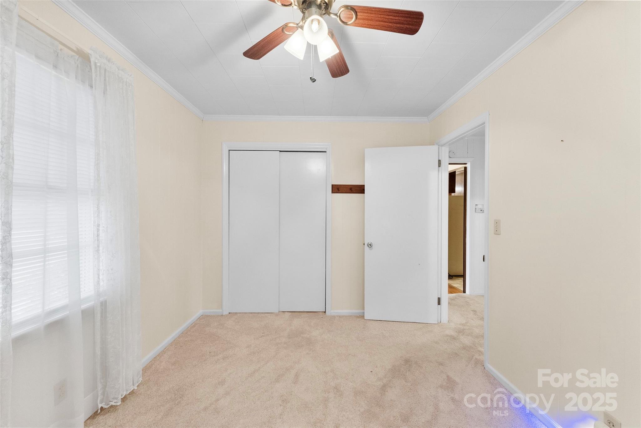 1819 Ratchford Road Dallas, NC 28034 - Photo 19 of 38 a view of a livingroom with a ceiling fan and window