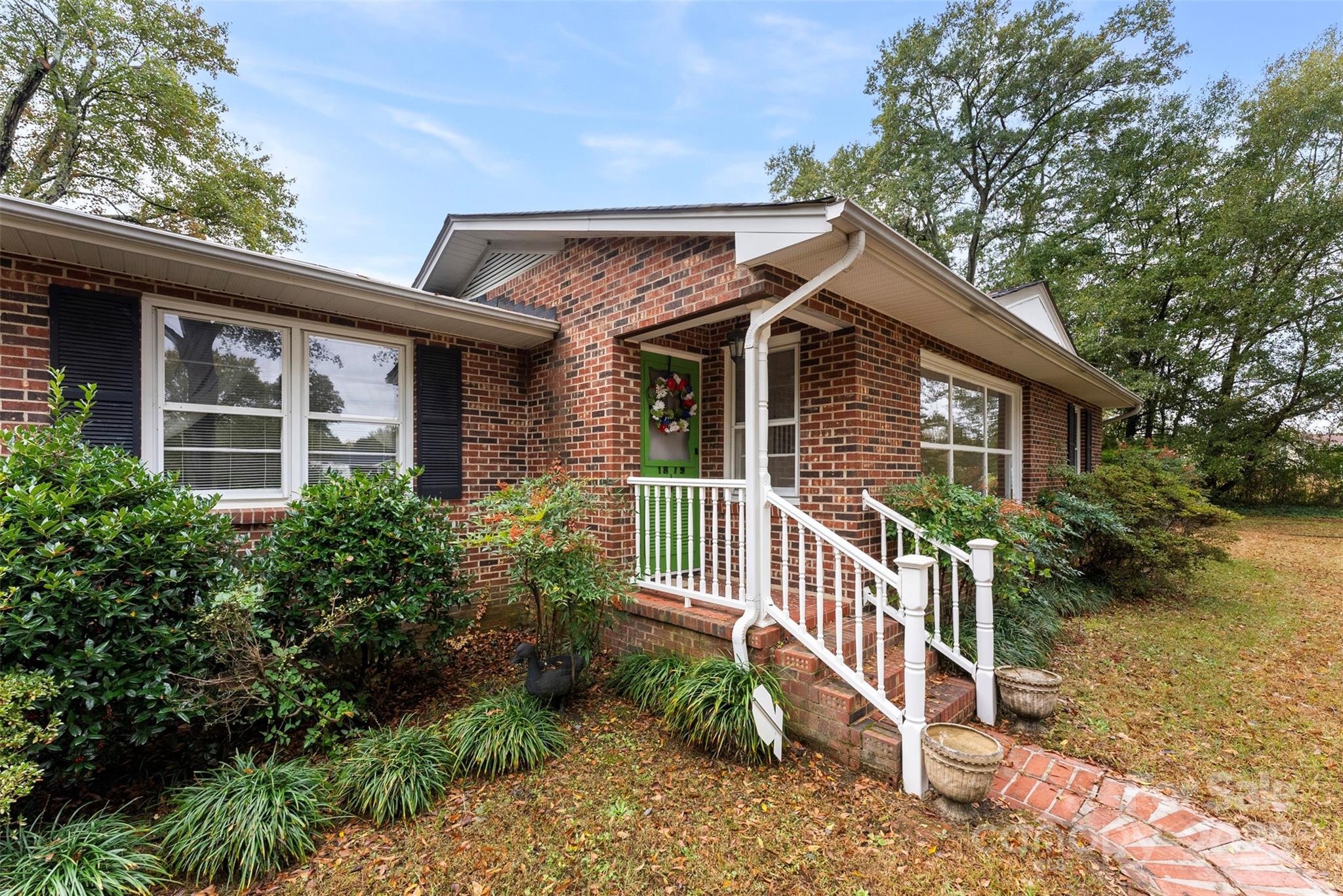 1819 Ratchford Road Dallas, NC 28034 - Photo 2 of 38 a front view of a house with a yard