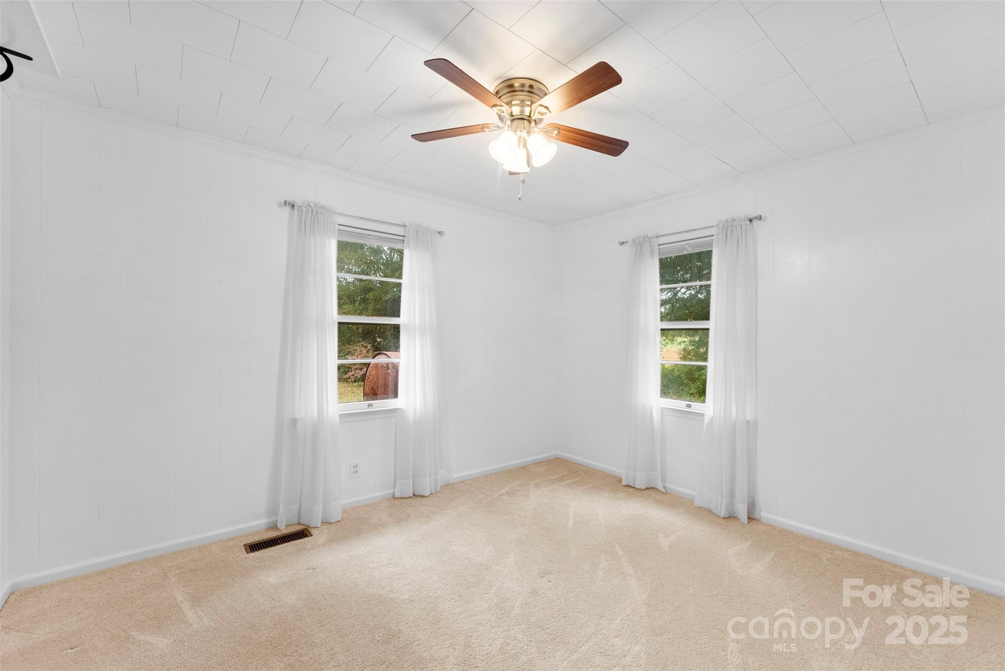 1819 Ratchford Road Dallas, NC 28034 - Photo 23 of 38 an empty room with a window and a fan