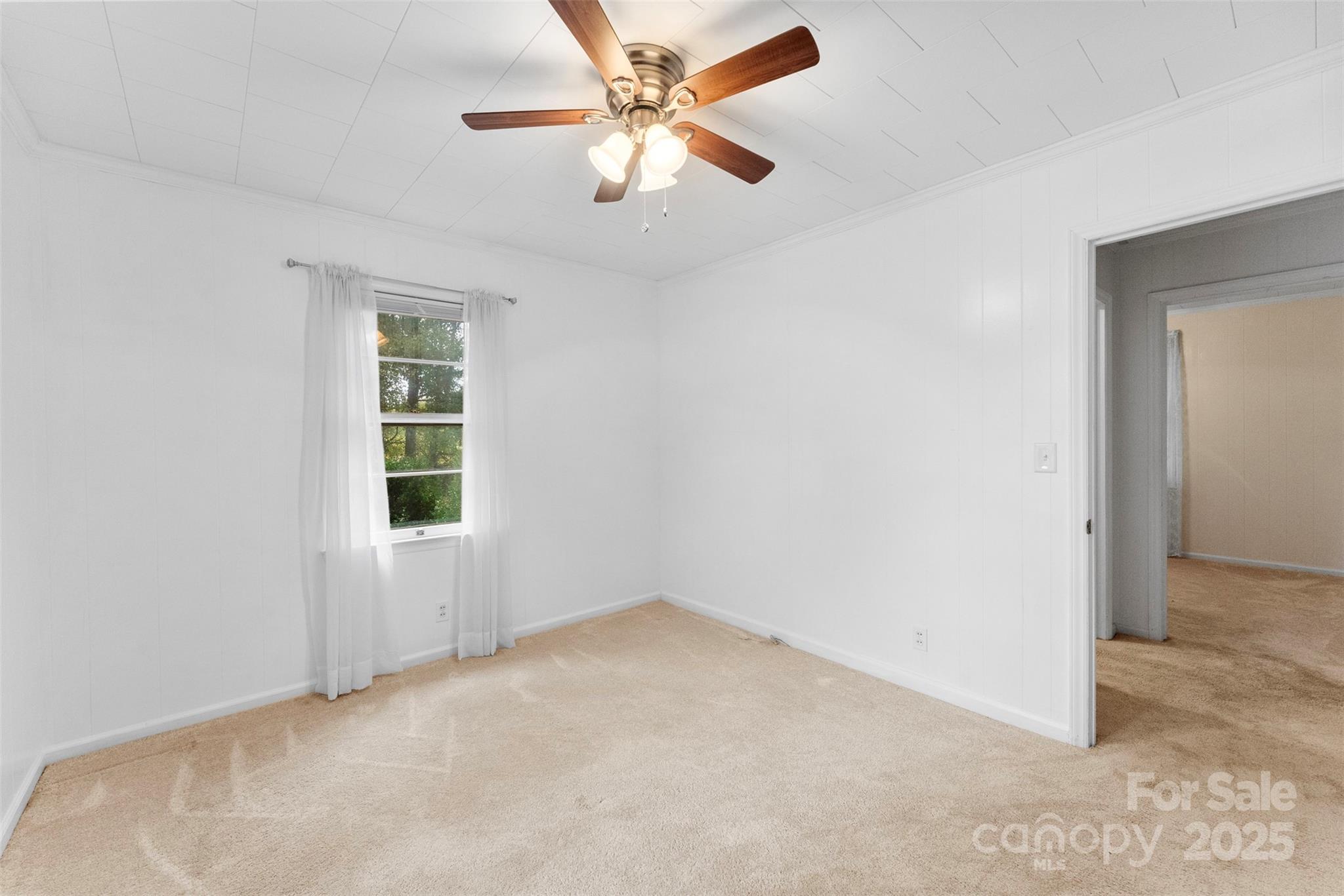 1819 Ratchford Road Dallas, NC 28034 - Photo 24 of 38 an empty room with windows and fan