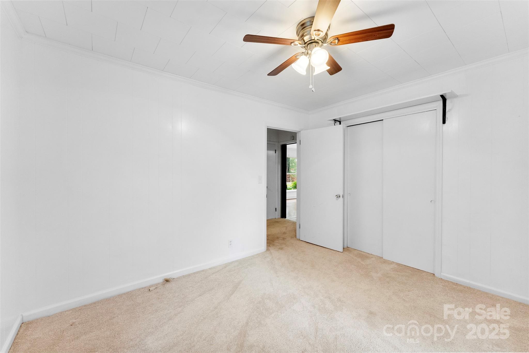 1819 Ratchford Road Dallas, NC 28034 - Photo 25 of 38 an empty room with closet and a ceiling fan