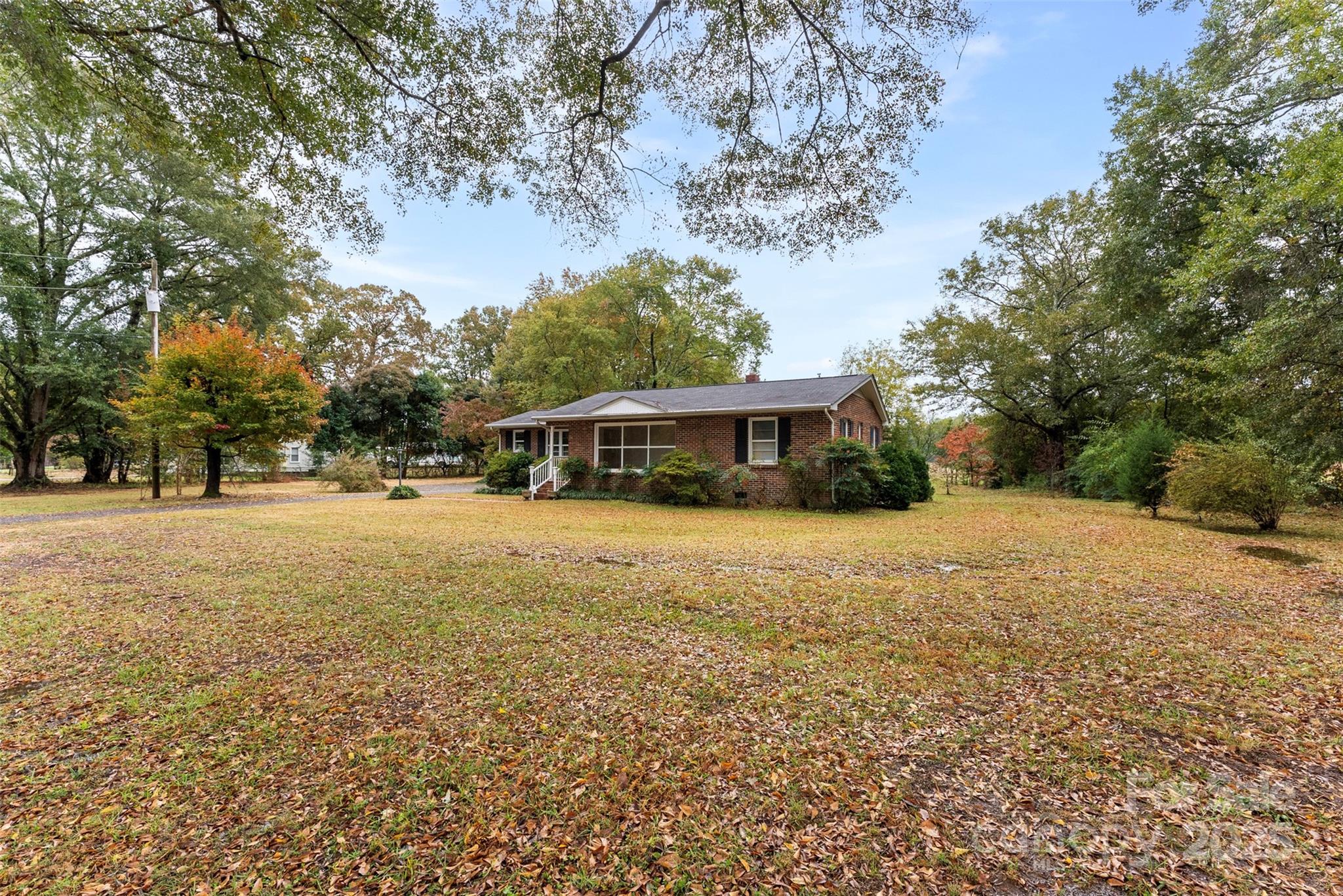 1819 Ratchford Road Dallas, NC 28034 - Photo 28 of 38 a front view of house with yard and green space