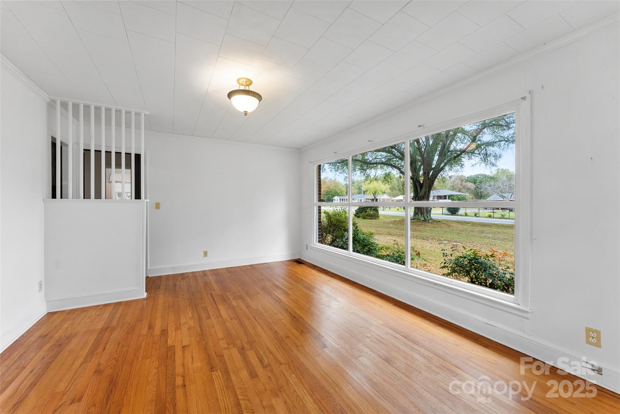1819 Ratchford Road Dallas, NC 28034 - Photo 3 of 38 wooden floor in an empty room with a window