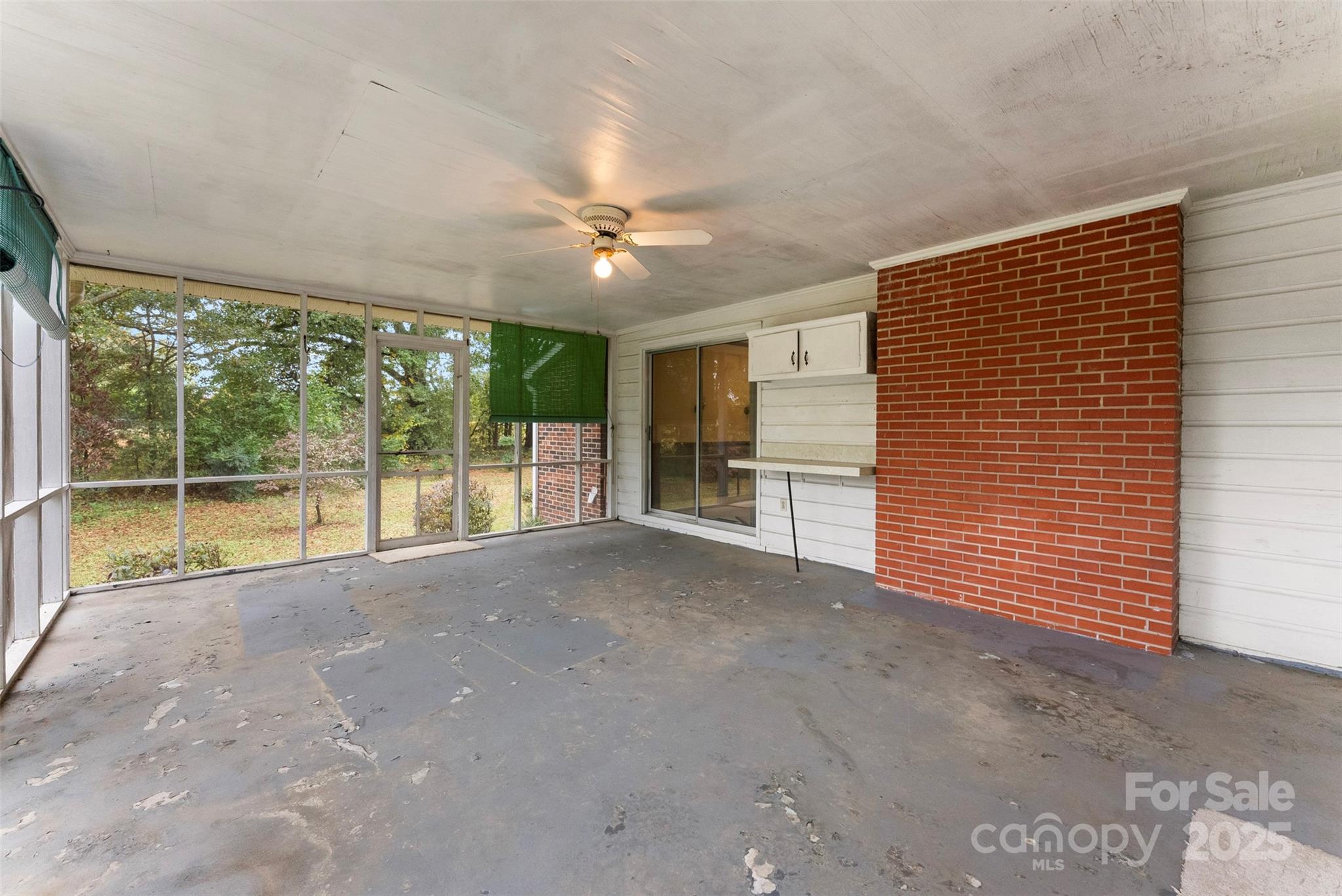 1819 Ratchford Road Dallas, NC 28034 - Photo 31 of 38 a view of an empty room with a fireplace and a large window