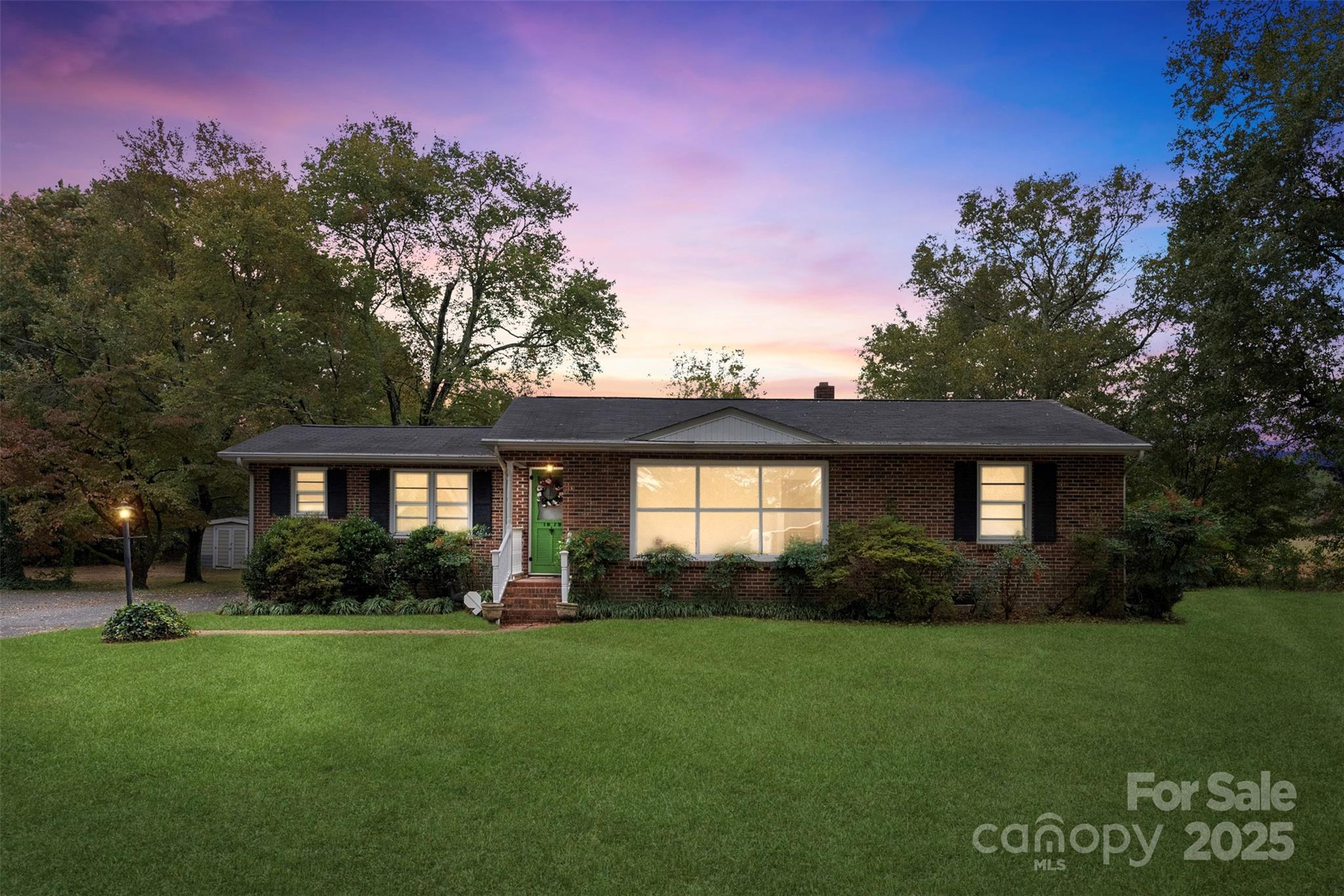 1819 Ratchford Road Dallas, NC 28034 - Photo 32 of 38 a front view of a house with a garden