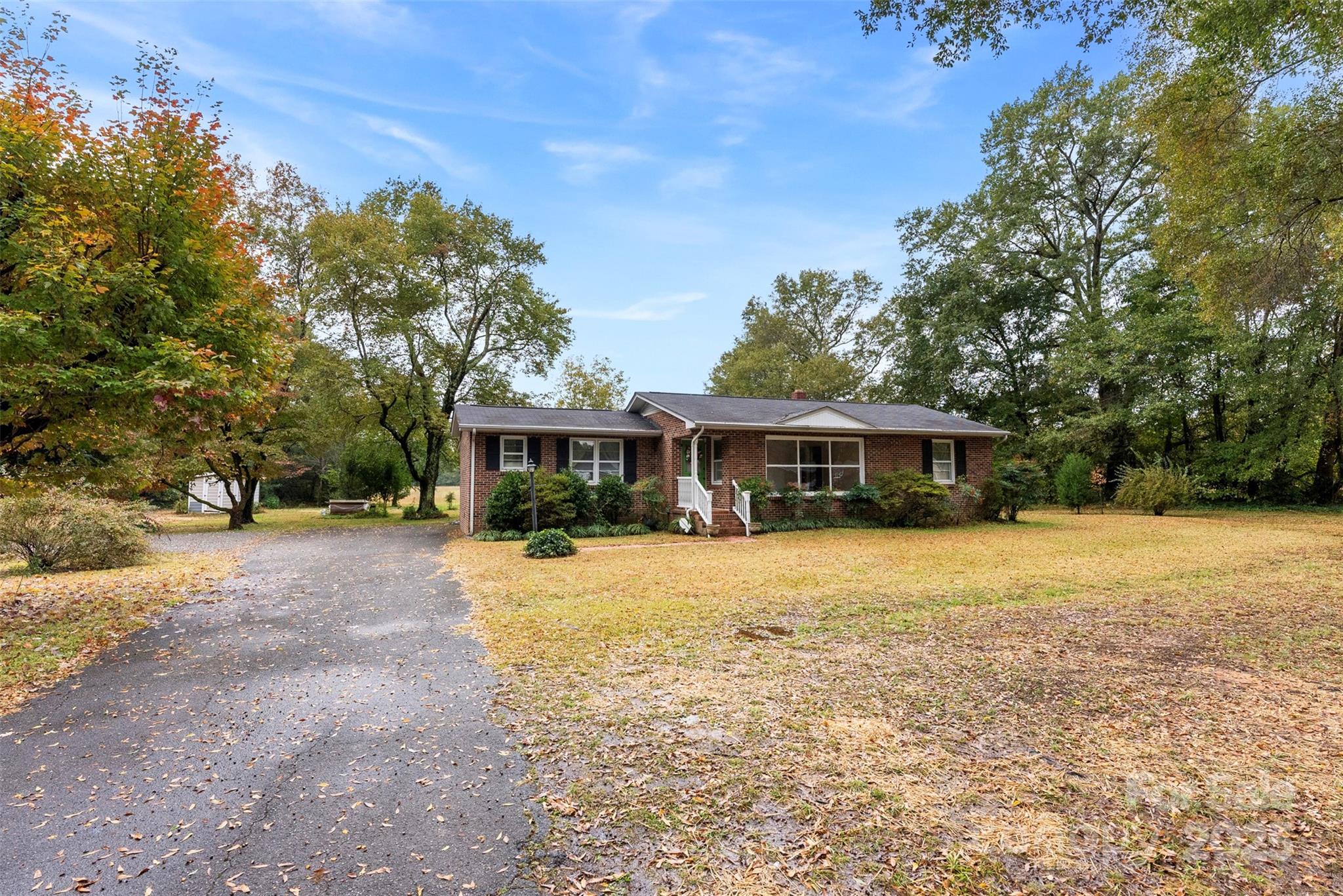 1819 Ratchford Road Dallas, NC 28034 - Photo 33 of 38 a front view of a house with a garden
