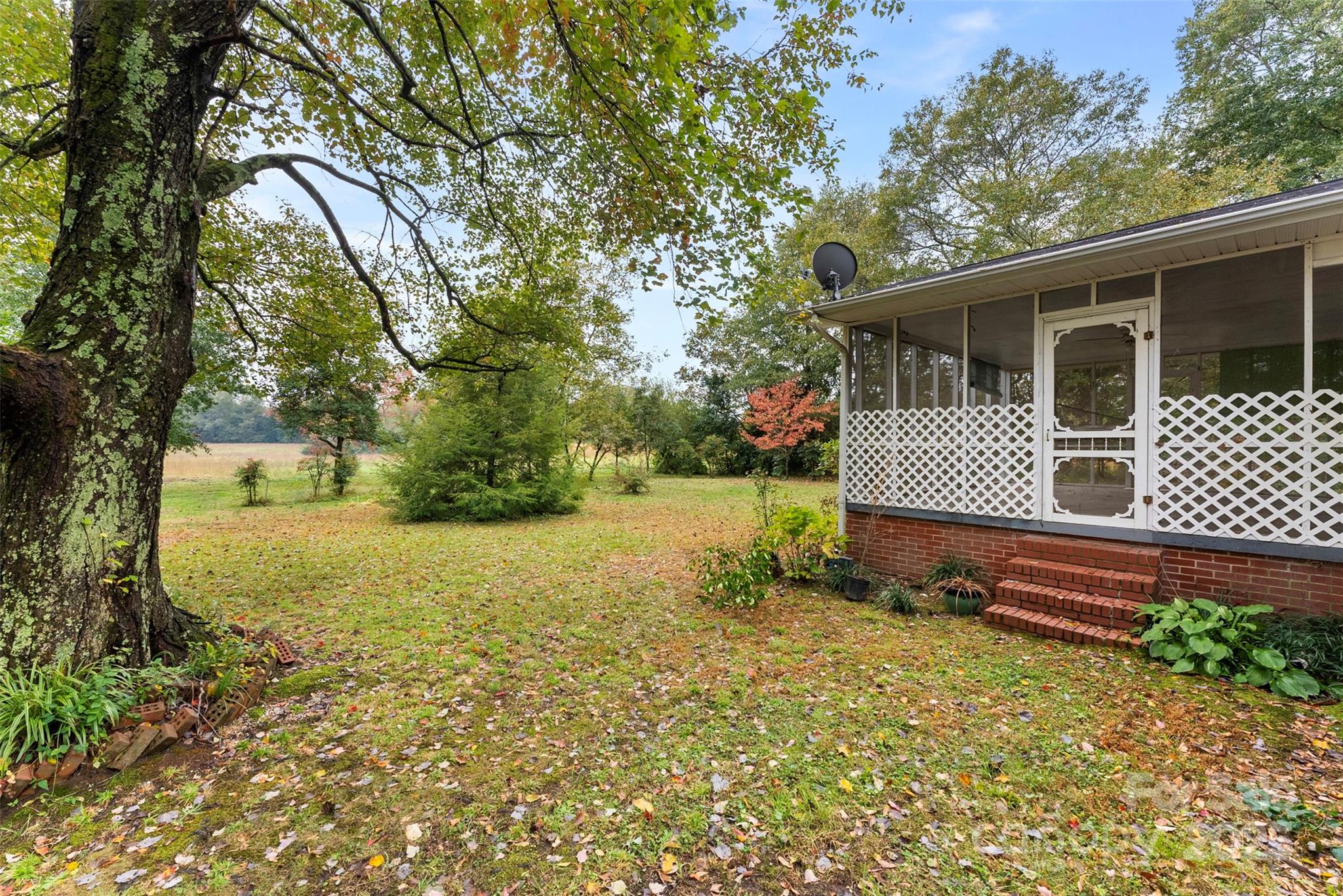 1819 Ratchford Road Dallas, NC 28034 - Photo 34 of 38 a view of a house with backyard and sitting area