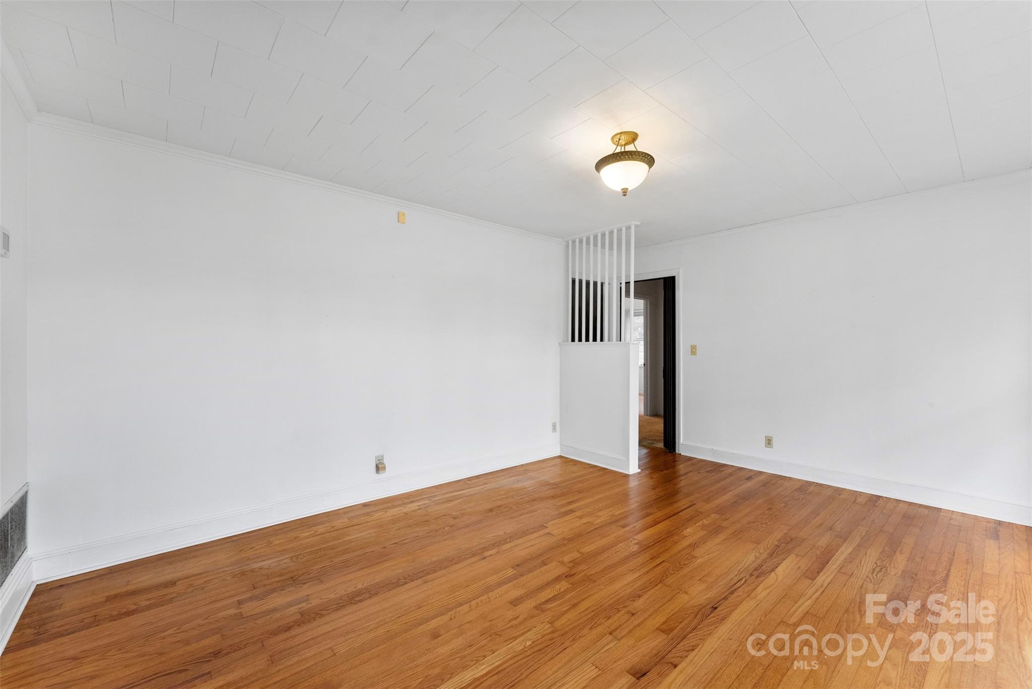 1819 Ratchford Road Dallas, NC 28034 - Photo 4 of 38 a view of empty room with wooden floor