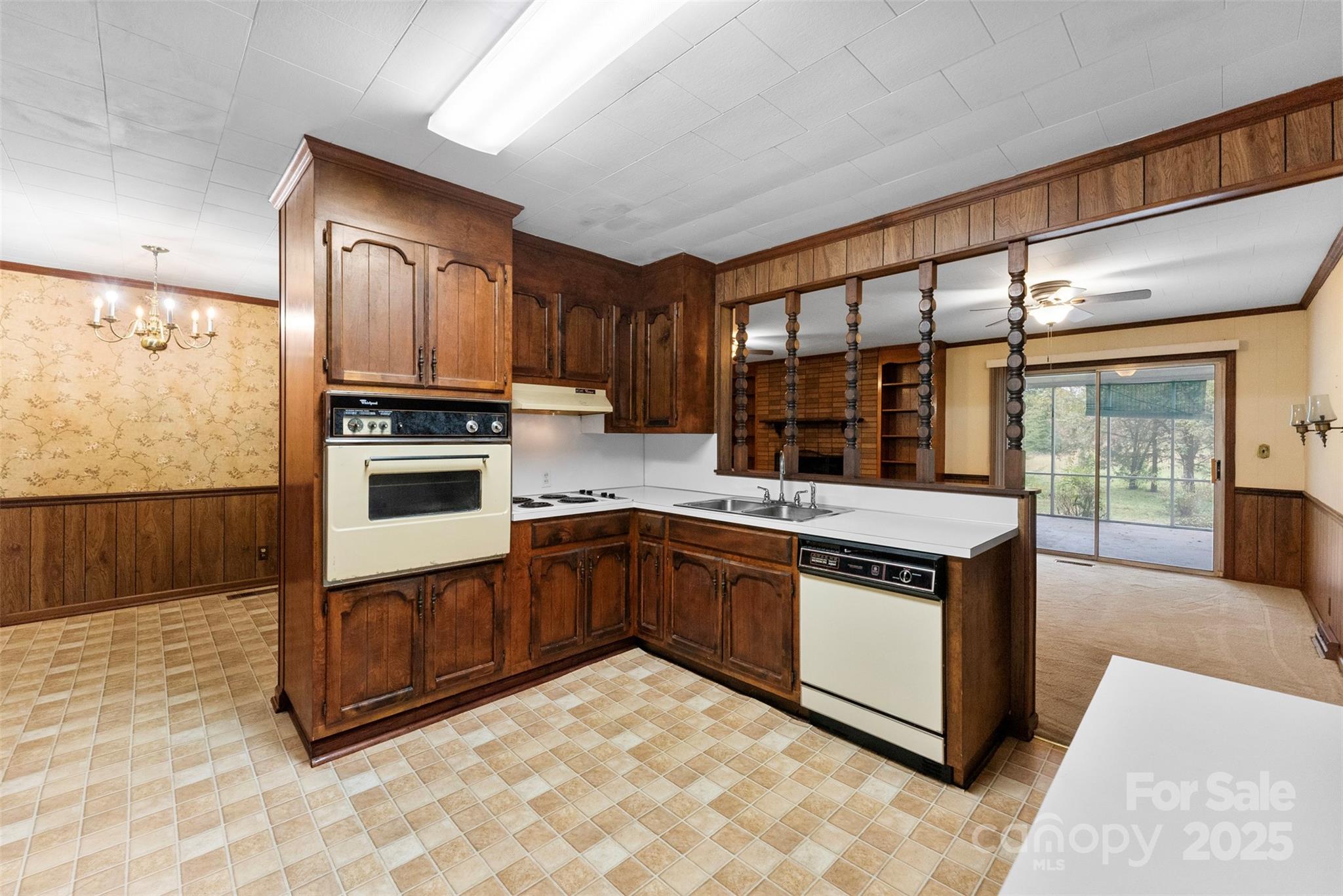 1819 Ratchford Road Dallas, NC 28034 - Photo 6 of 38 a kitchen with stainless steel appliances granite countertop a stove a sink and a microwave