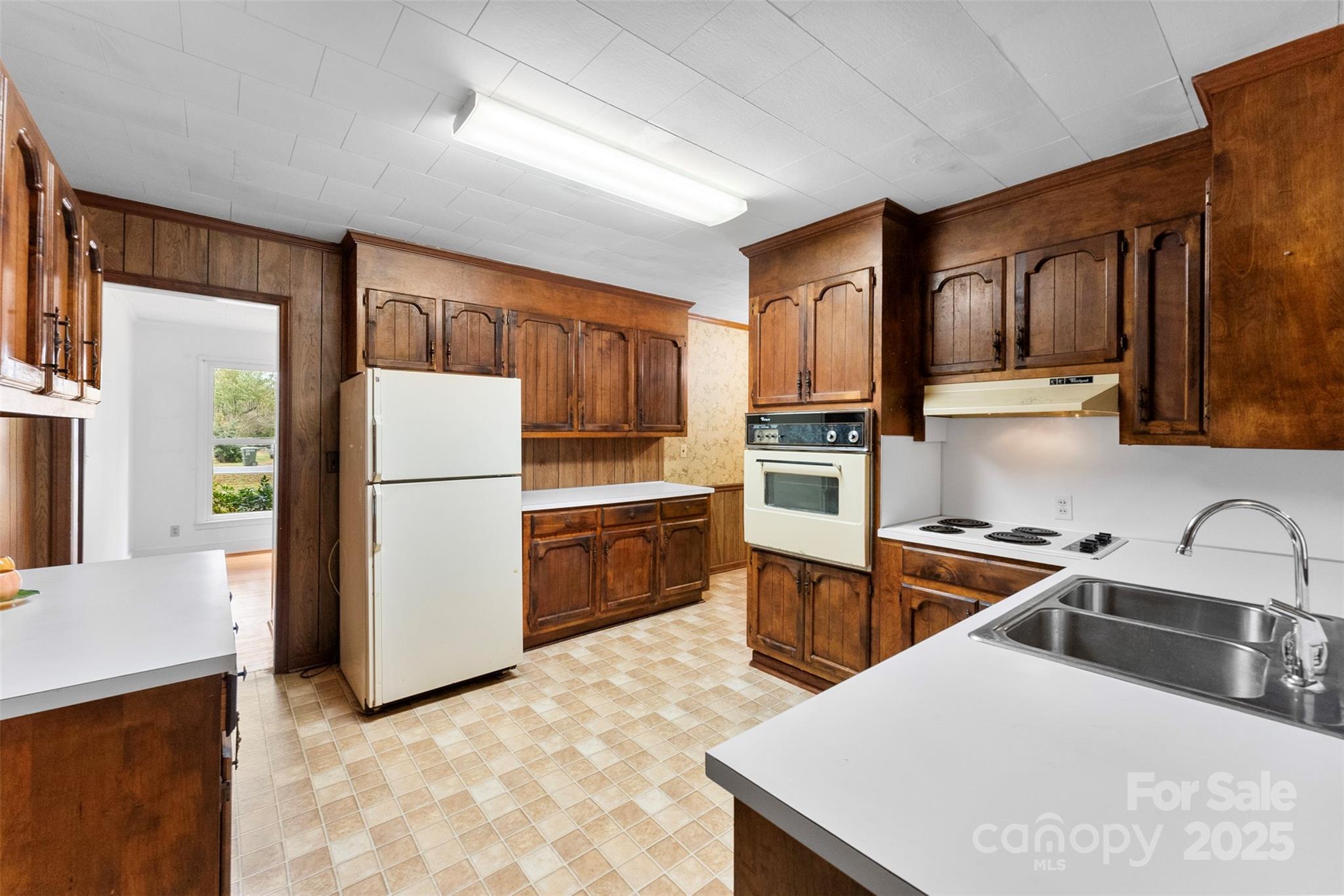 1819 Ratchford Road Dallas, NC 28034 - Photo 7 of 38 a kitchen with a refrigerator sink and stove