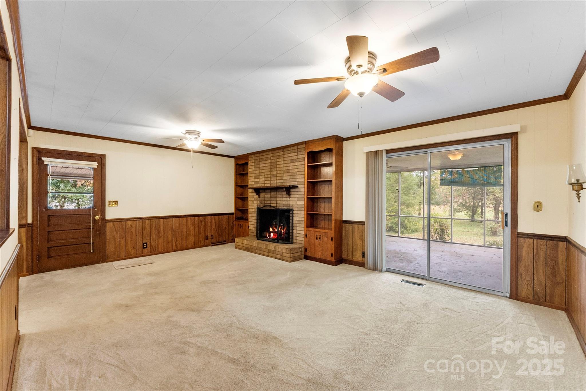 1819 Ratchford Road Dallas, NC 28034 - Photo 10 of 38 a view of an empty room with furniture and a ceiling fan