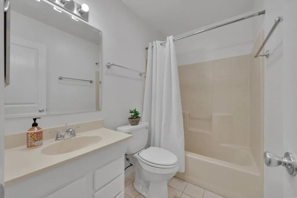 9015 Campo Road Spring Valley, CA 91977 - Photo 24 of 58 a bathroom with a sink toilet and shower
