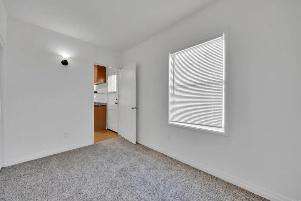 9015 Campo Road Spring Valley, CA 91977 - Photo 38 of 58 a view of an empty room with a window