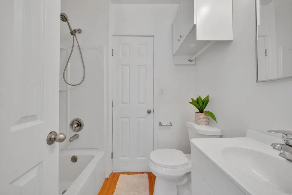 9015 Campo Road Spring Valley, CA 91977 - Photo 41 of 58 a bathroom with a sink a toilet and shower
