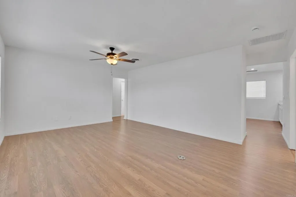 9015 Campo Road Spring Valley, CA 91977 - Photo 8 of 58 a view of an empty room with a chandelier fan