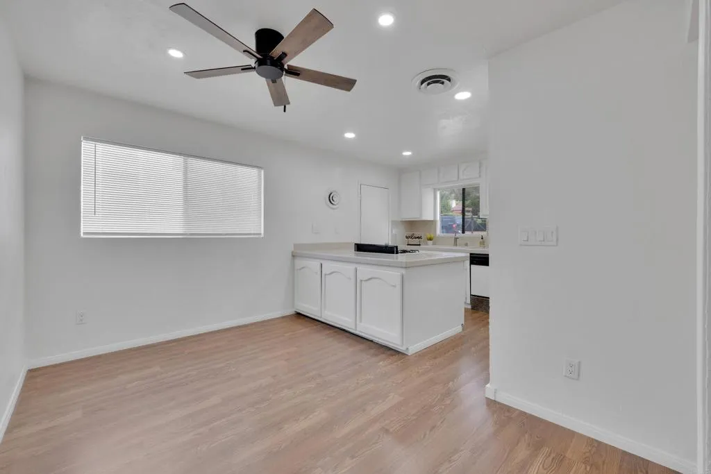 9015 Campo Road Spring Valley, CA 91977 - Photo 10 of 58 a view of kitchen with sink microwave and cabinets