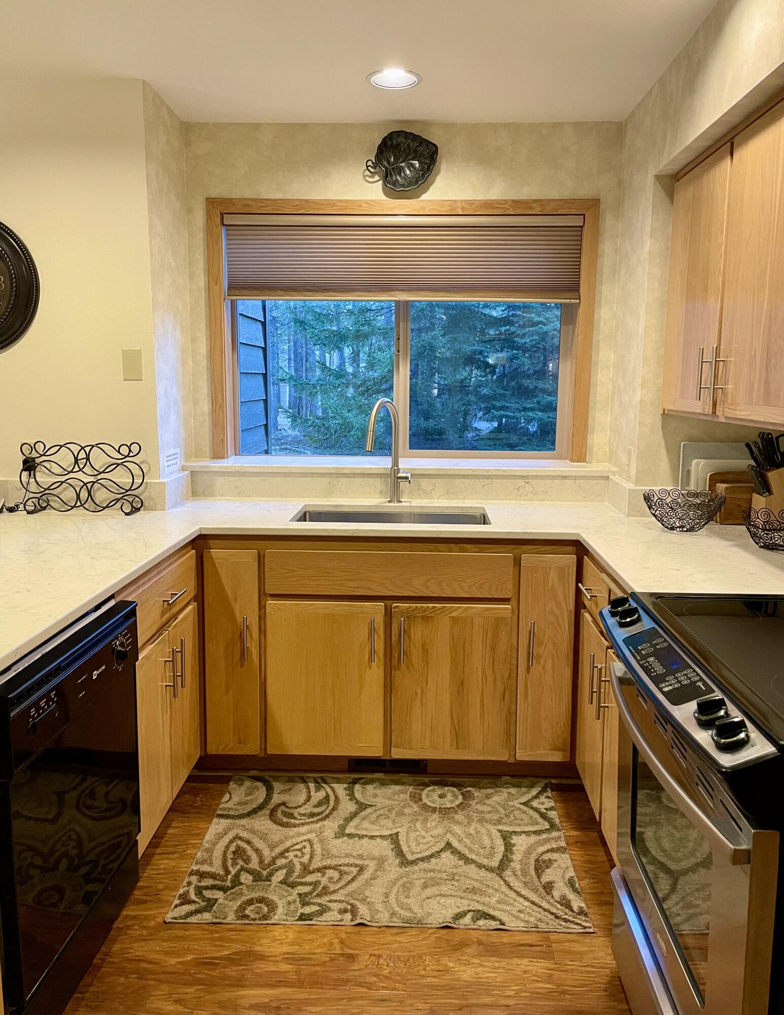 57376 Beaver Ridge Loop, Unit 33C1 Sunriver, OR 97707 - Photo 12 of 35 a view of a kitchen with a sink and a window