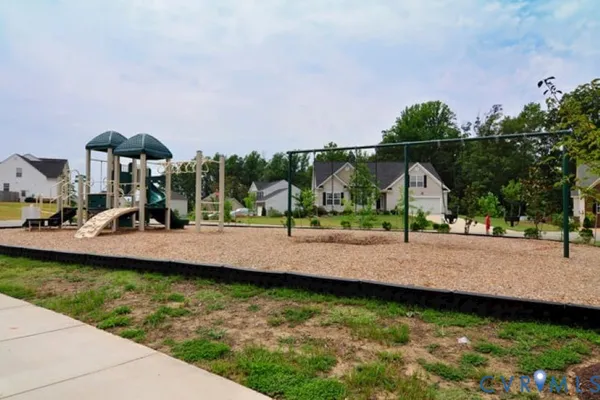 a view of a house with swimming pool and yard