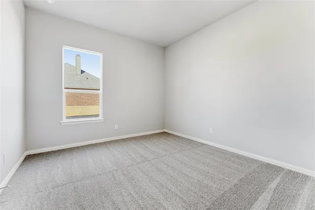 a bathroom with a sink a toilet and a large mirror